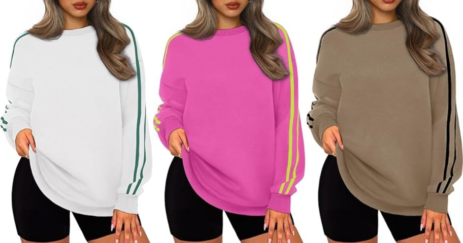 3 women wearing different color oversized sweatshirts with 2 stripes on the sleeves