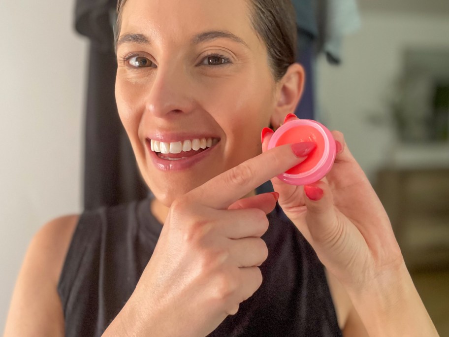 woman using lip balm