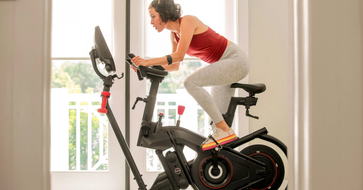 woman riding the Bowflex VeloCore Bike 16"