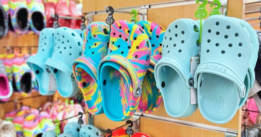 kids crocs hanging from store display