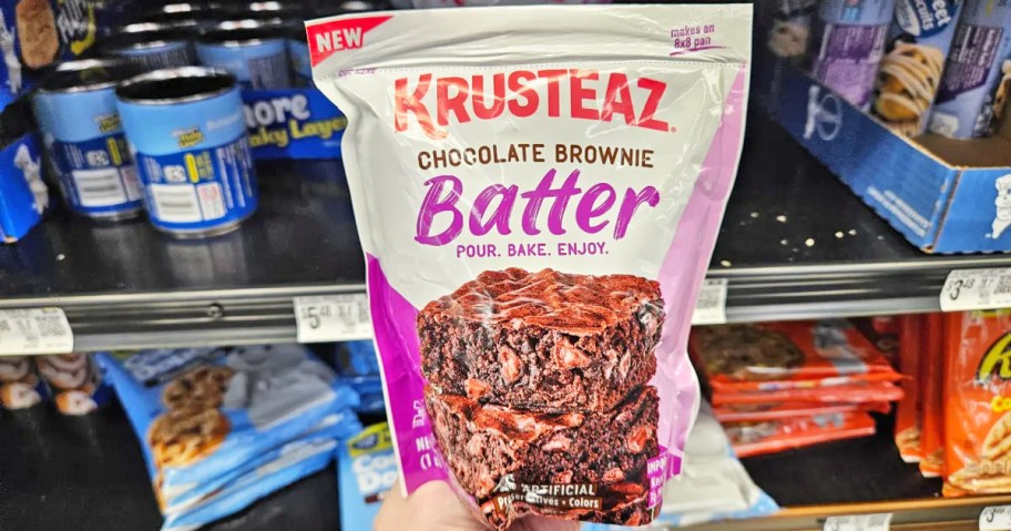 hand holding a Krusteaz Brownie Batter package