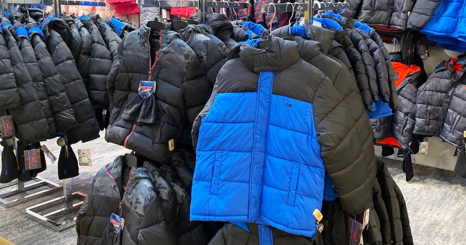 black and blue puffer coats on store display