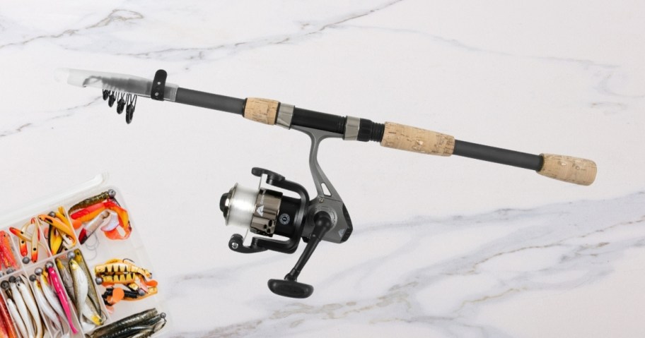 telescoping fishing rod with tackle box on counter