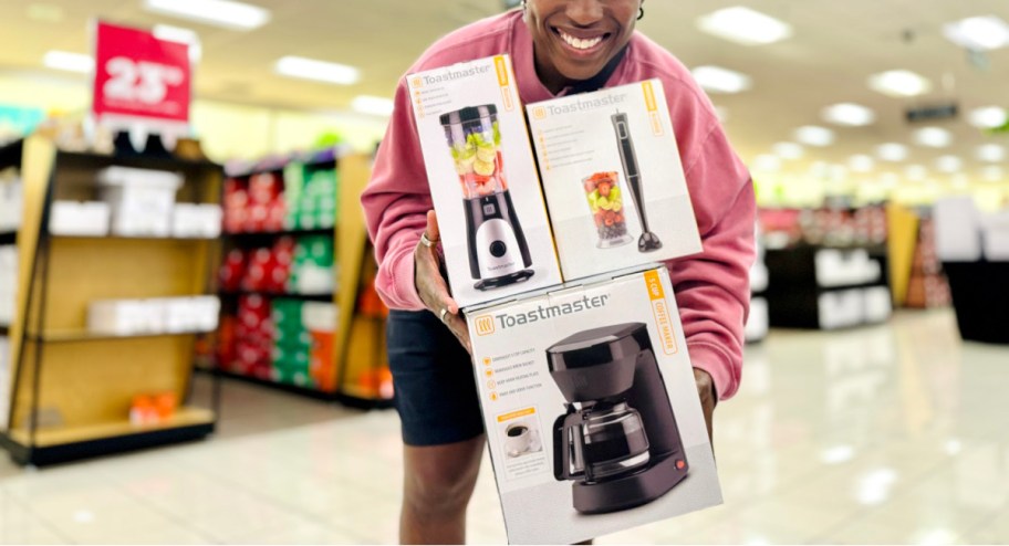 Woman holding toastmaster appliances at the kohls store
