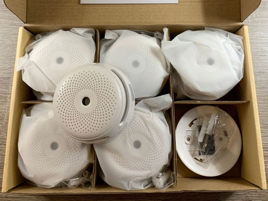 a six pack of X-Sense Smoke Detectors