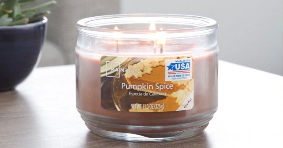 pumpkin spice candle on table