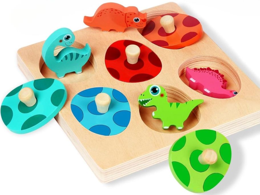 Wooden Dinosaur Character Puzzle stock image