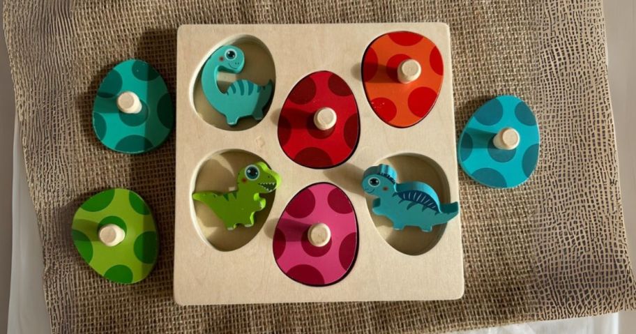 Wooden Dinosaur Character Puzzle on cloth