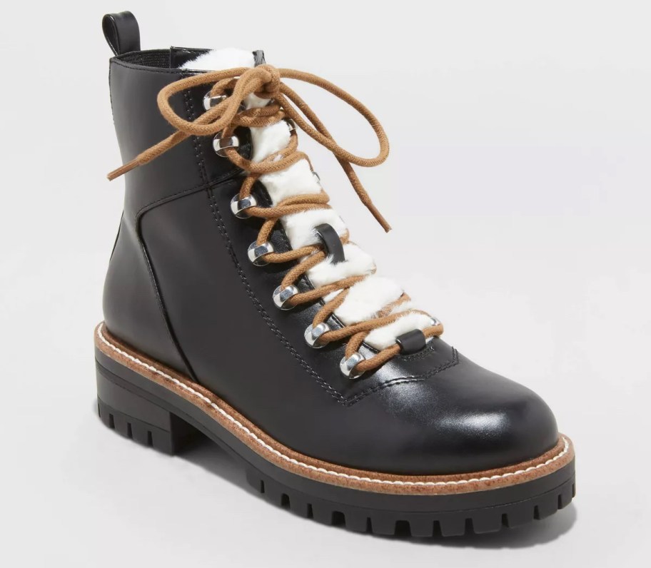 stock photo of black and white faux fur boot