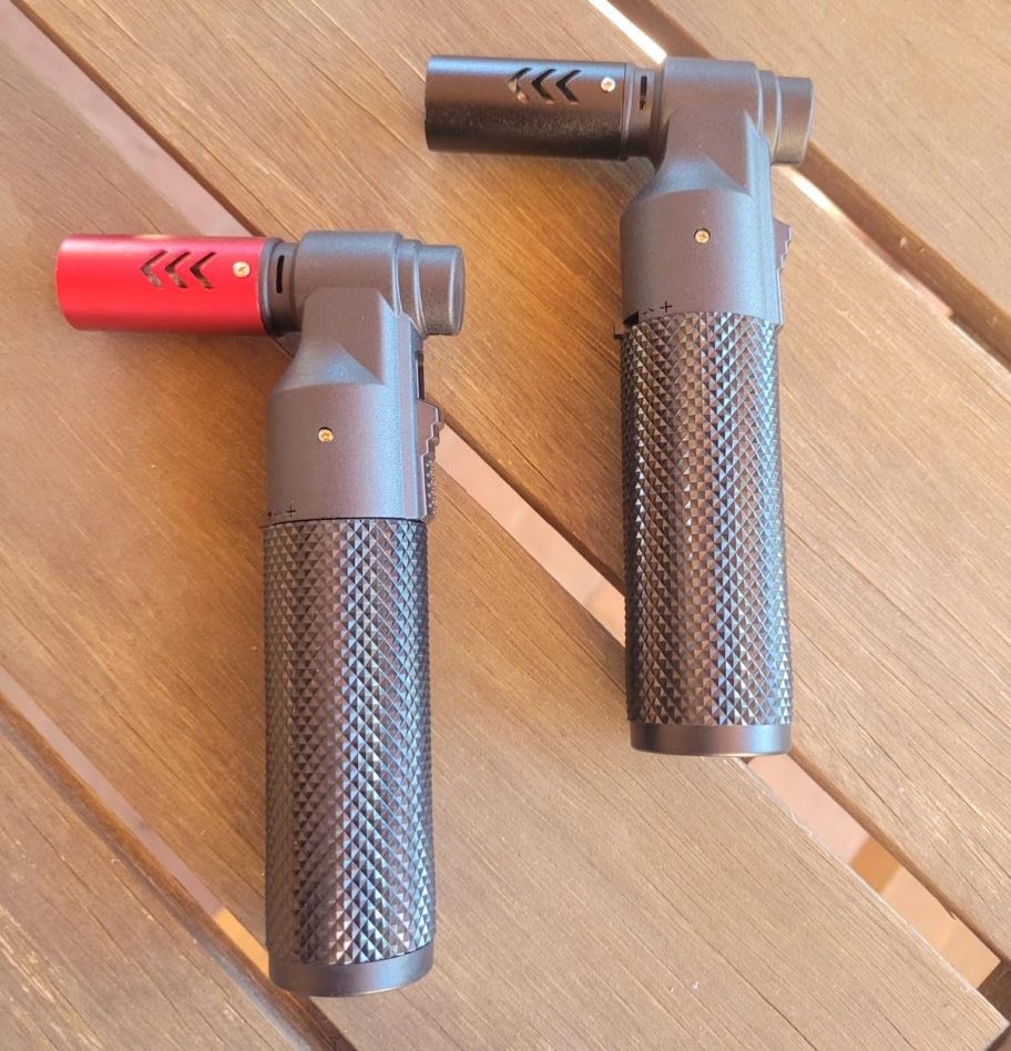 two butane torches on wood surface
