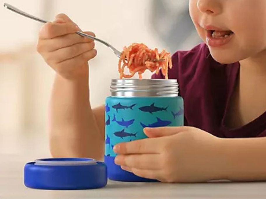 Girl eating from a Bentgo Steel Food Jar