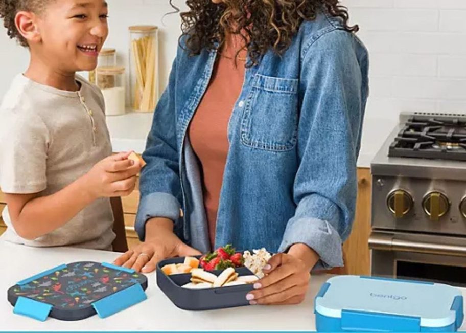 Boy and mom at a counter with Bentgo Kids Snap & Go Lunch Boxes