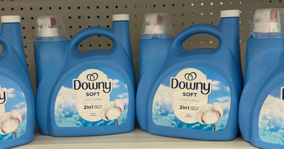 Jugs of Downy Fabric Softener on a store shelf