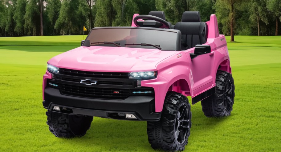 Ford bronco 2 seater in pink displayed on a golf course