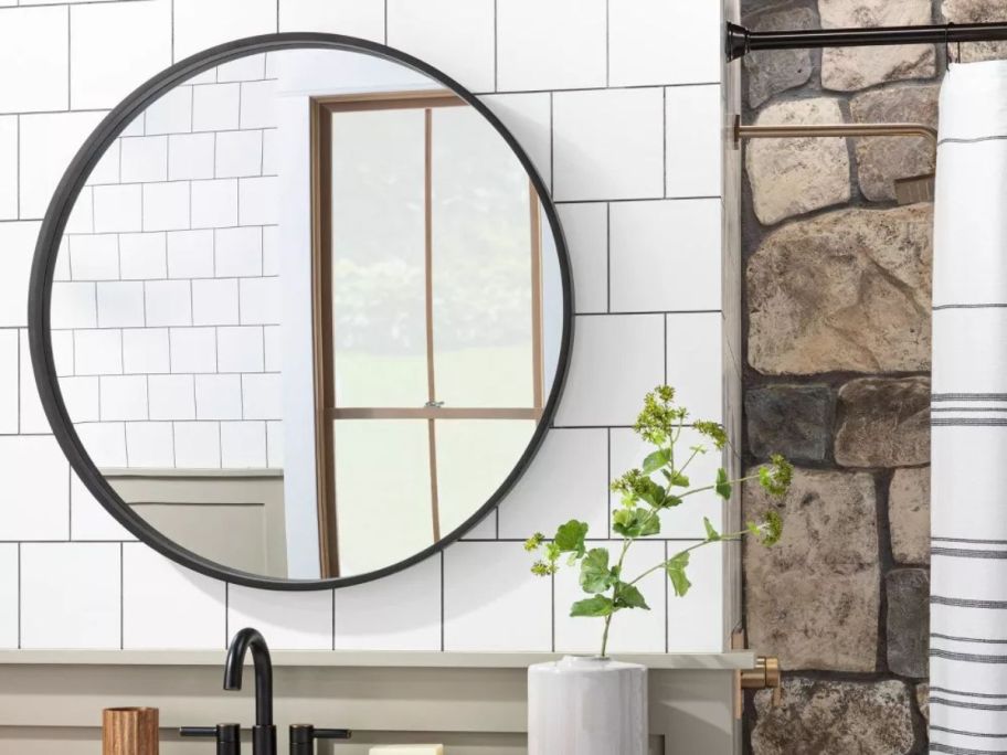 Hearth & Hand w/ Magnolia 30" Round Wood Framed Wall Mirror on wall above sink in bathroom