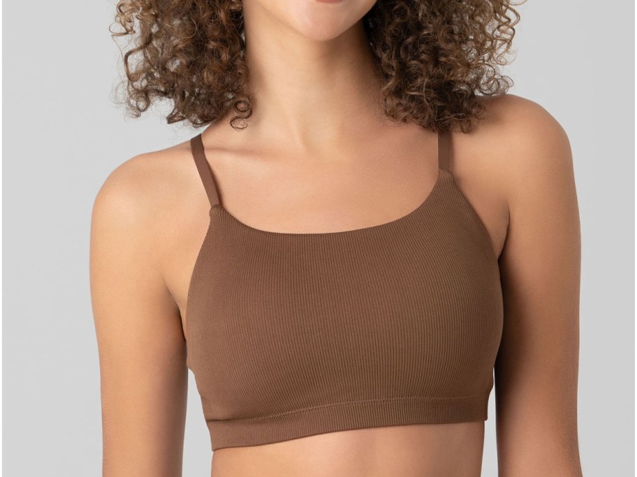 woman wearing No Boundaries Seamless Ribbed Cami Bralette in brown