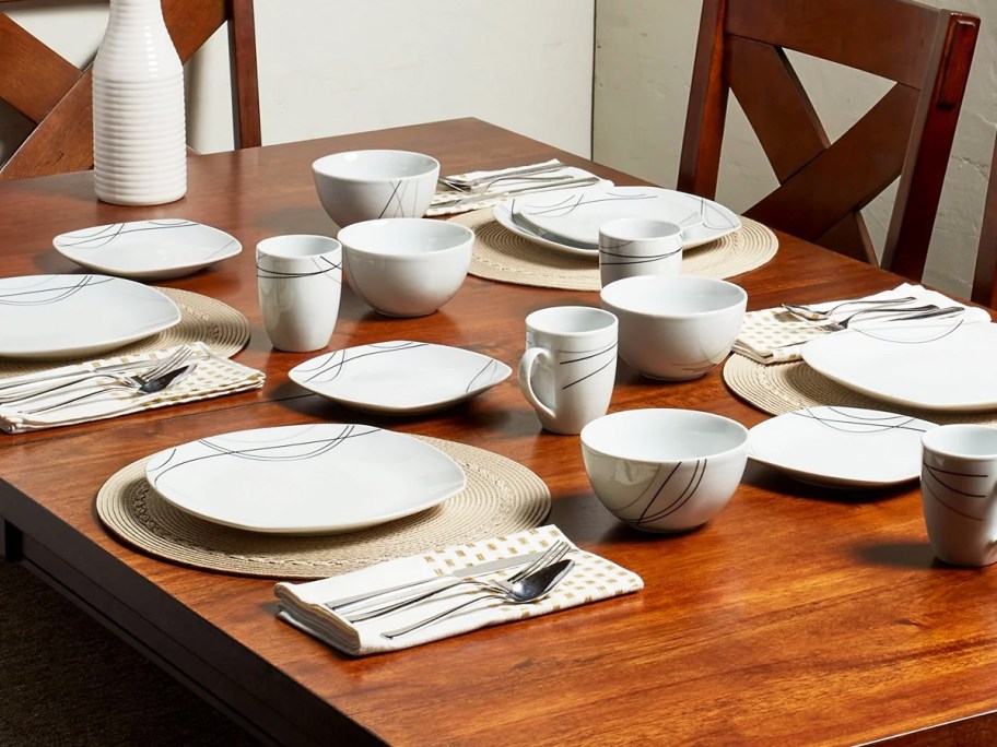 dining table set with white dishes