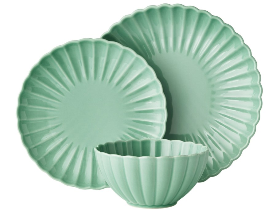 display of scalloped bowl, and different size plates in green