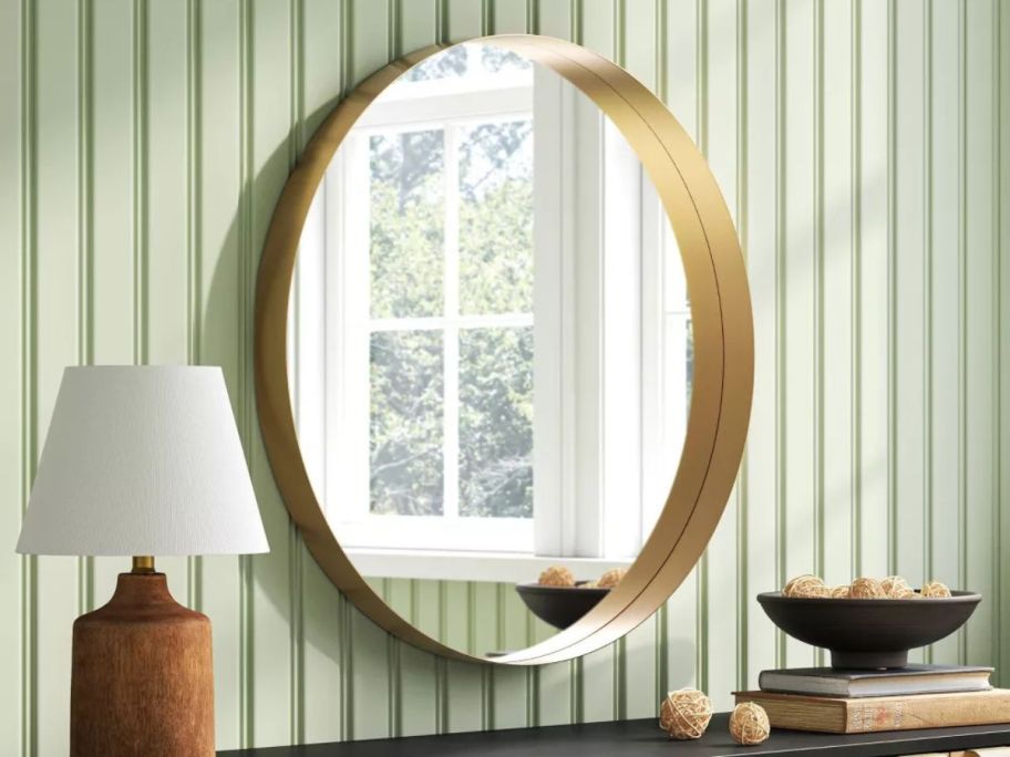 Threshold 30" Flush Mount Round Decorative Wall Mirror on wall in living room above desk