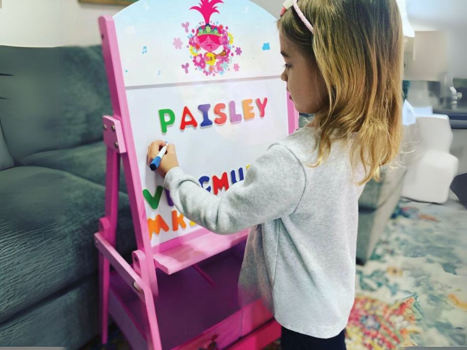 girl using Trolls World Tour Activity Easel