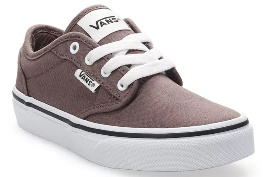 a brown Vans kid's shoe with aces