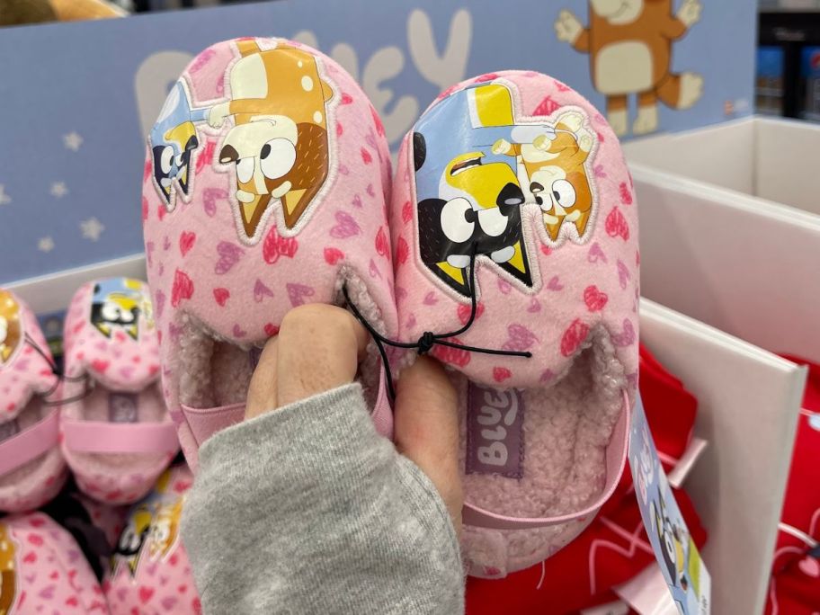 Hand holding up Bluey Toddler Slippers