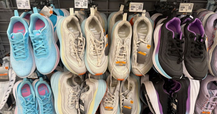 blue, beige, and black avia women's shoes hanging in store