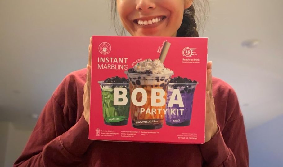 girl holding boba kit party box