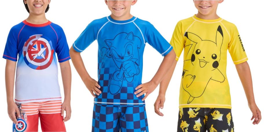 3 boys wearing character rash guards and swim trunks
