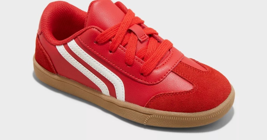 a kids red and white sneaker