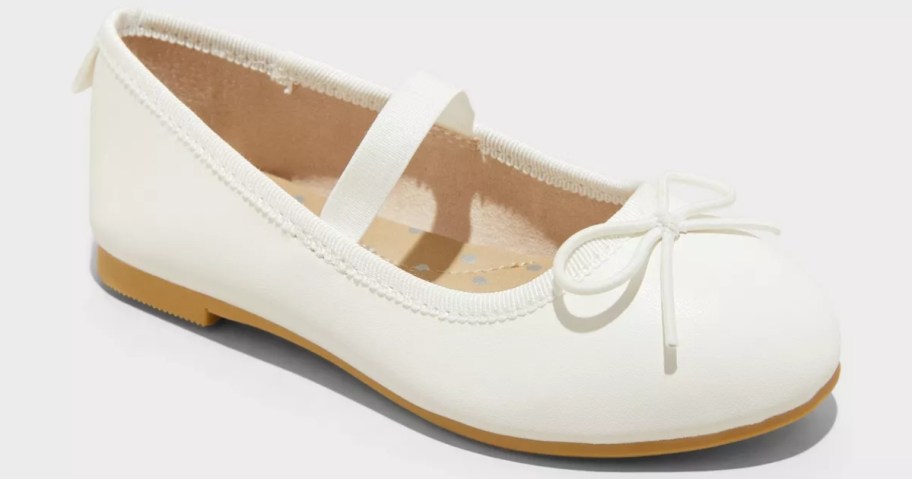 a girls white ballet flat style shoe
