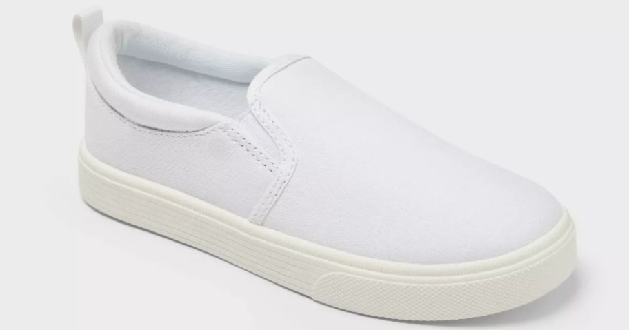a kids solid white slip on sneaker