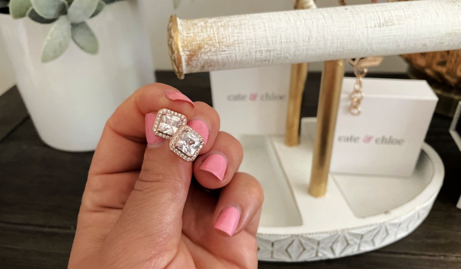 cate and chloe earrings in hand