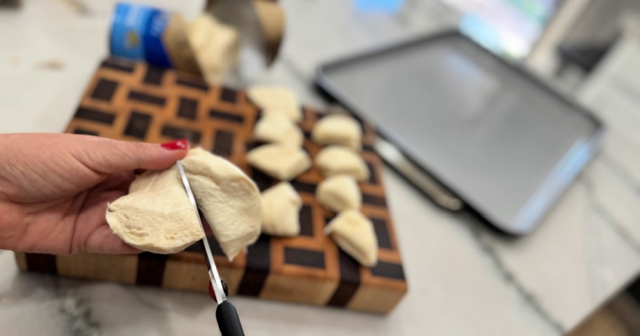 cutting biscuit dough with scissors