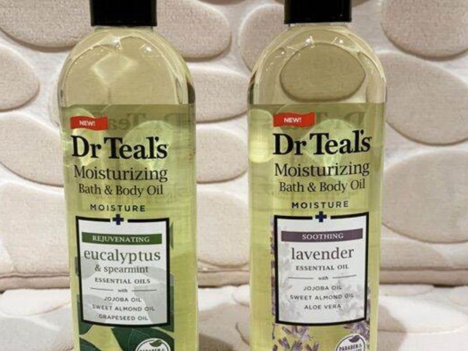 two dr. teal's bath and body oil bottles in Lavender and Eucalyptus & Spearmint