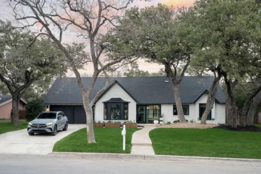 Mercedes parked in driveway of ranch home