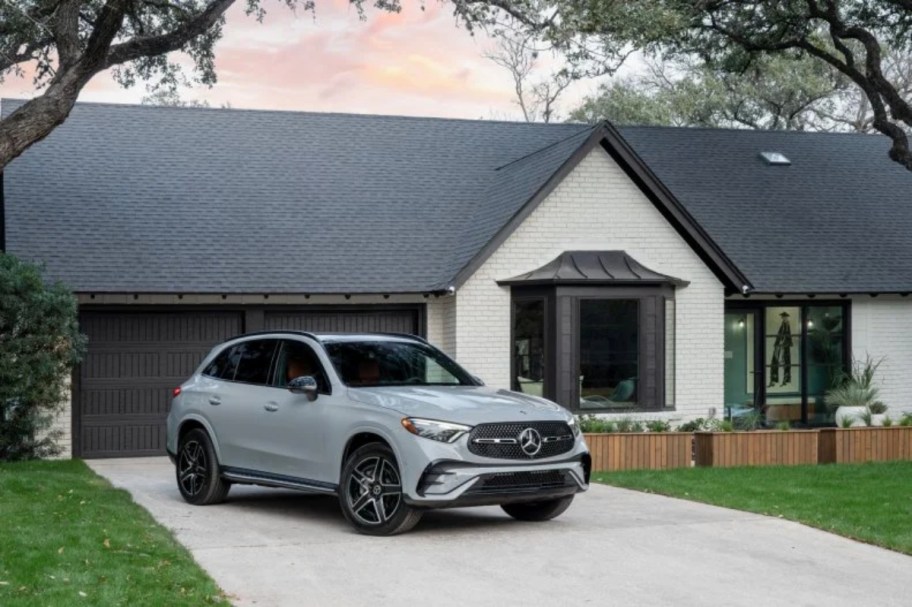 Mercedes parked in driveway of ranch home