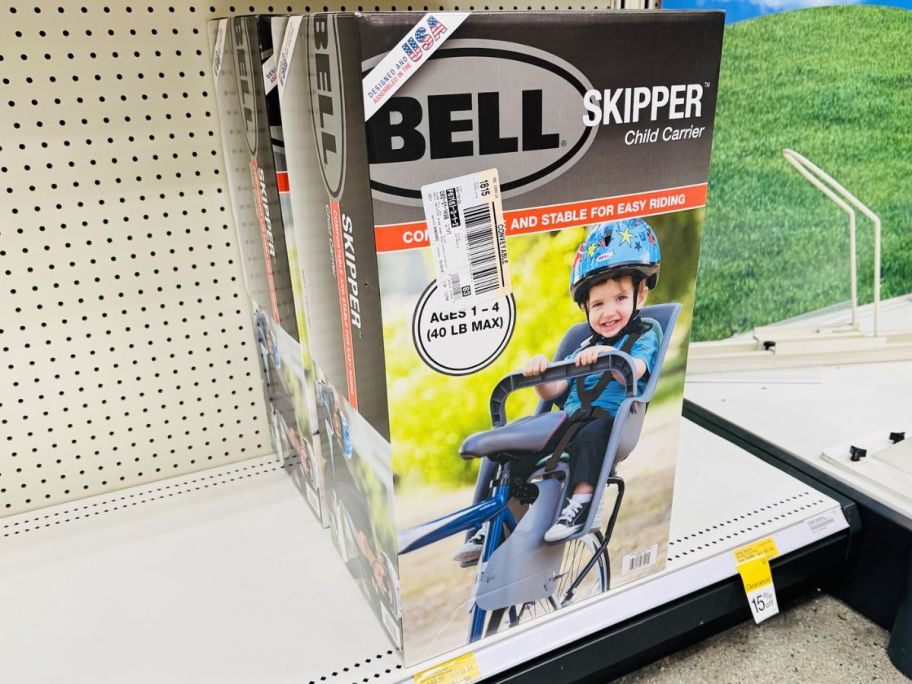 a bike seat for a toddler on a store shelf