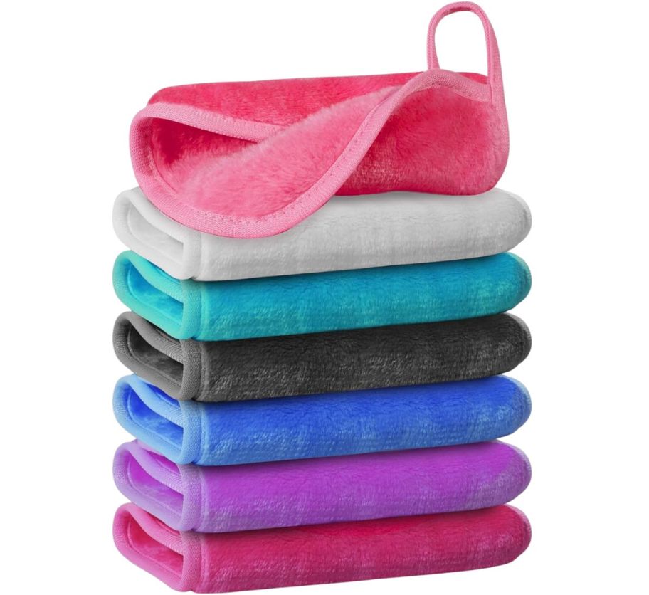 a 7 piece stack of makeup remover cloths in various colors folded and stacked