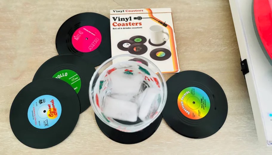 a drink sitting on a record vinyl coaster