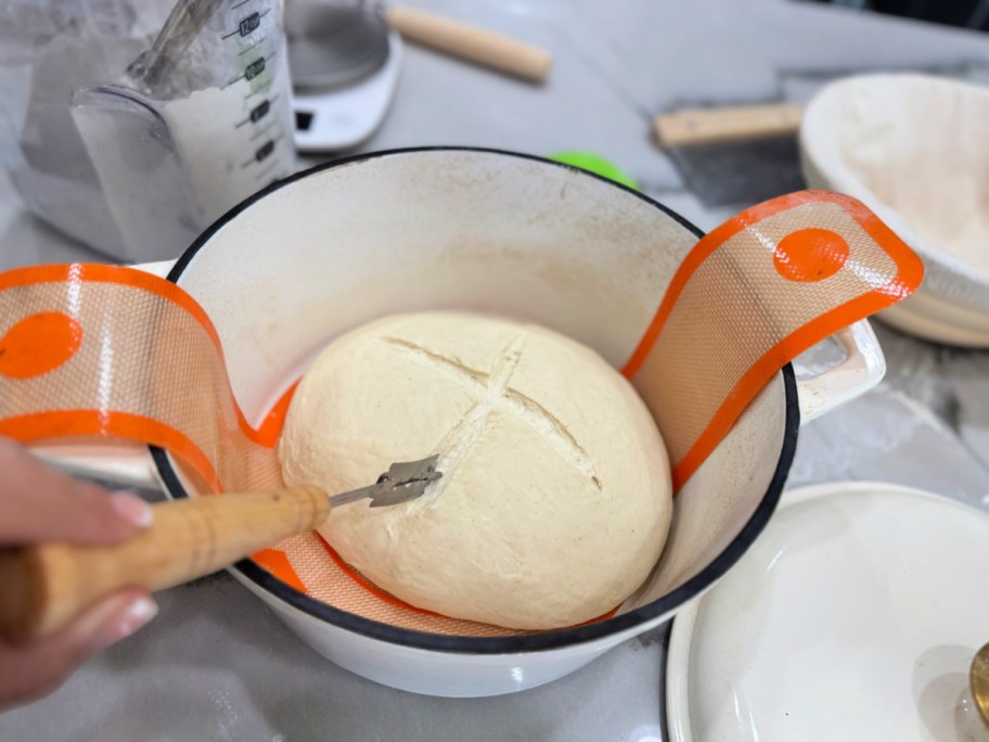scoring sourdough bread before baking 