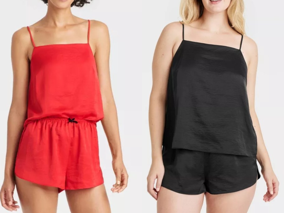 2 women wearing cami top and shorts pajama sets, one set is red, the other is black