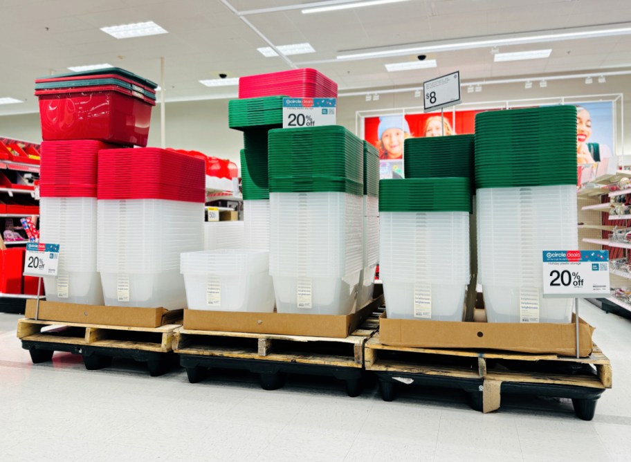 storage bins in holiday red and green on display in a Target store