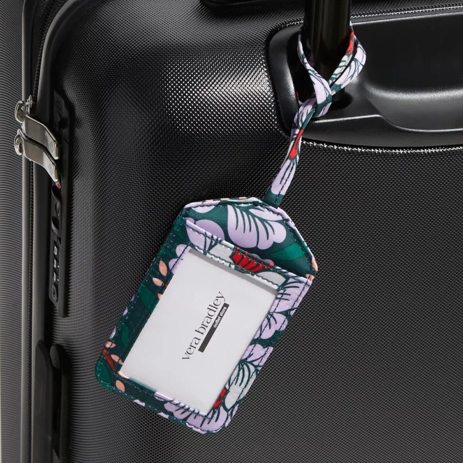 vera bradley luggage tag on black suitcase