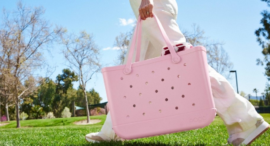 woman swinging new color target bogg bags