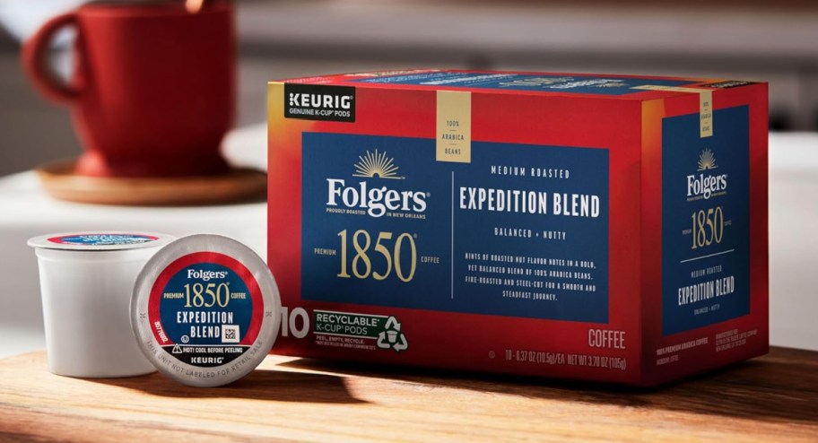1850 by Folgers Pioneer Blend Medium Roast Coffee 10 Count displayed on top of the table