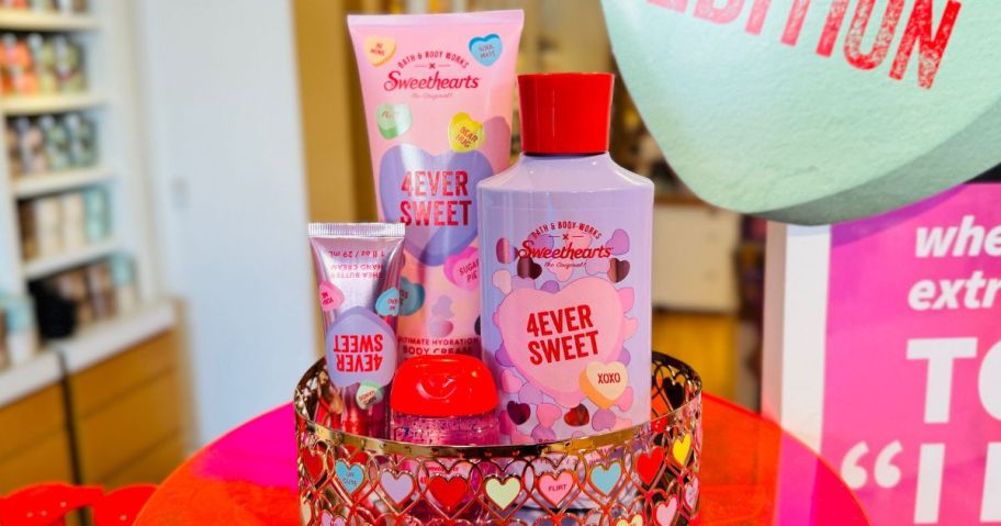A metal tray with Bath & Body Works x Sweethearts 4EVER Sweet Collection Body Care products