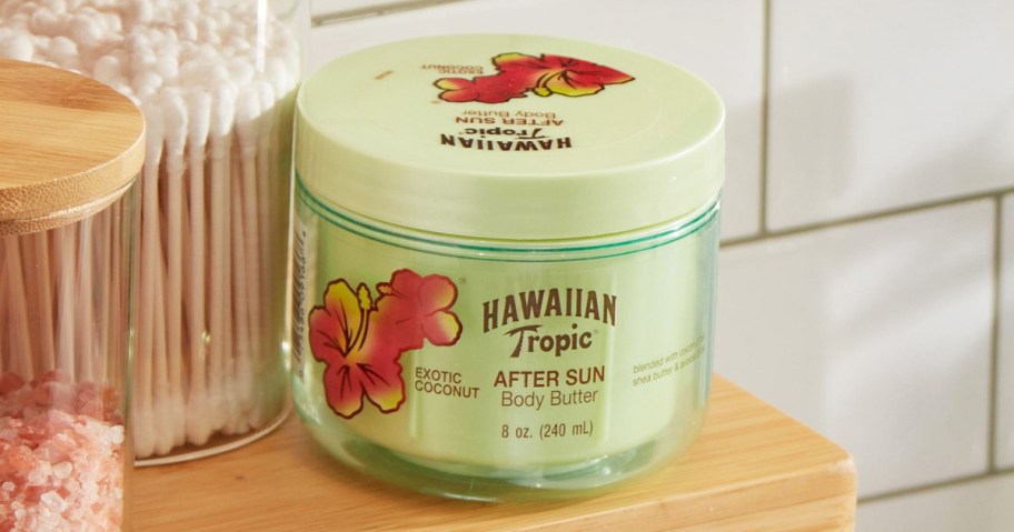 green jar of Hawaiian Tropic After Sun Body Butter on bathroom shelf