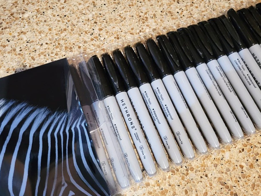 large set of black permanent markers