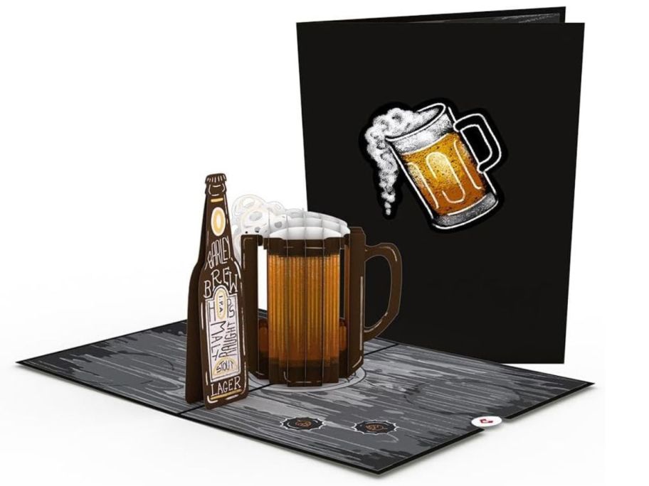 A 3-d popup card of a bottle an mug of beer